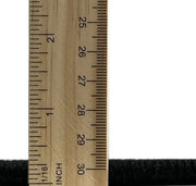 6' x 9' Abstract Dark Almond Brown Modern Area Rug thickness measurement image showing the low-profile pile height next to a ruler for scale.
