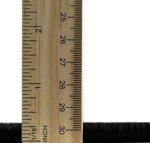 6' x 9' Abstract Dark Almond Brown Modern Area Rug thickness measurement image showing the low-profile pile height next to a ruler for scale.
