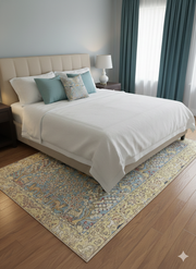 6' x 9' Rectangle Blue & Ivory Floral Traditional Area Rug placed in a cozy bedroom setting.