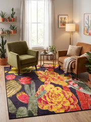 6' x 9' Rectangular Black & Multicolor Cactus Floral Botanical Southwestern Area Rug styled in a living room with an olive green armchair and tan sofa.