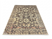 6' x 9' Rectangular Brown Beige Floral Traditional Washable Area Rug displayed in an angled product view on a white background, showcasing its intricate floral pattern, ornate border, and distressed brown and beige details.