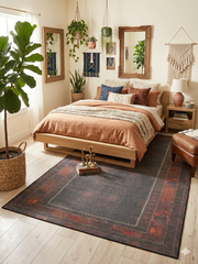 6' x 9' Rectangular Dark Brown & Rust Tribal Border Traditional Washable Area Rug styled in a bedroom with a wooden bed, layered bedding, and wall decor.