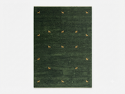 6' x 9' Rectangular Forest Green Gold Animal Motif Southwestern Washable Area Rug featuring small gold deer motifs across a deep green background.