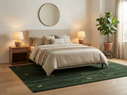 6' x 9' Rectangular Forest Green Gold Animal Motif Southwestern Washable Area Rug styled in a bedroom with a beige upholstered bed and wooden nightstands.