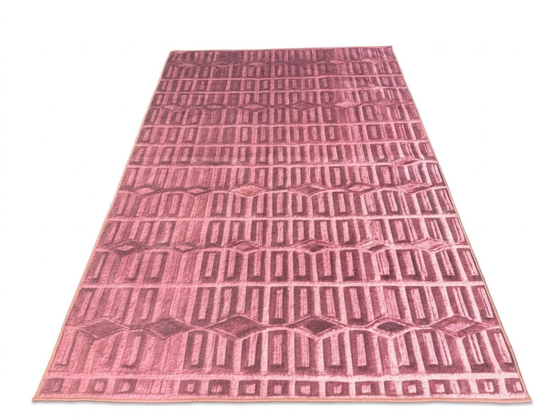 6' x 9' Rectangular Mauve Pink Geometric Modern Washable Area Rug featuring repeating rectangular grid patterns and diamond accents.