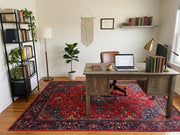 6' x 9' Rectangular Red Navy Floral Medallion Traditional Area Rug styled in a home office with a wooden desk, leather chair, and bookshelf.