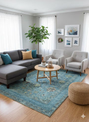 6' x 9' Rectangular Teal Blue & Sage Green Traditional Floral Medallion Washable Non-Slip Backing Area Rug styled in a cozy modern living room beneath a coffee table with a sectional sofa and accent chairs.