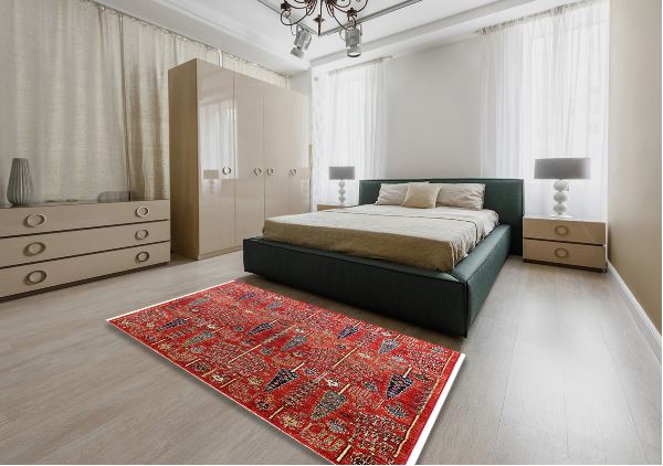 6' x 9' Red Mid-Century Modern Oriental Area Rug staged in a spacious bedroom interior, demonstrating its size and decorative impact within the room.