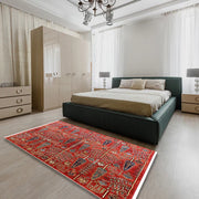 6' x 9' Red Mid-Century Modern Oriental Area Rug styled in a modern bedroom setting, emphasizing the bold pattern and warm color palette.