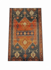 6' x 9' rectangular area rug featuring a multi-color southwestern geometric pattern in rust, charcoal, cream, and warm earth tones with a decorative border.