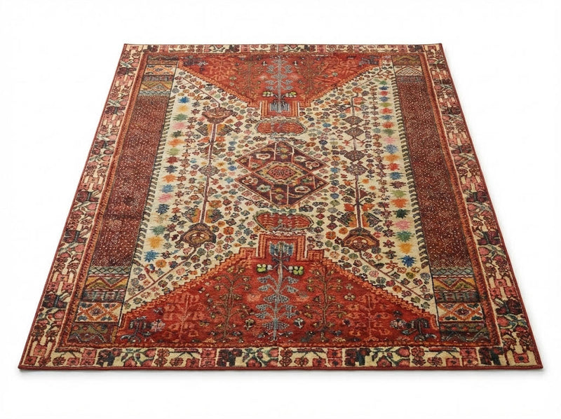6' x 9' rectangular area rug featuring a multi-color tribal medallion traditional design in shades of red, cream, blue, and gold with a detailed border.
