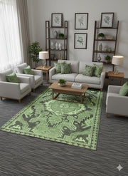 6' x 9' sage and olive green geometric washable area rug with tribal-style motifs placed in a neutral living room with light sofas and wood accents.
