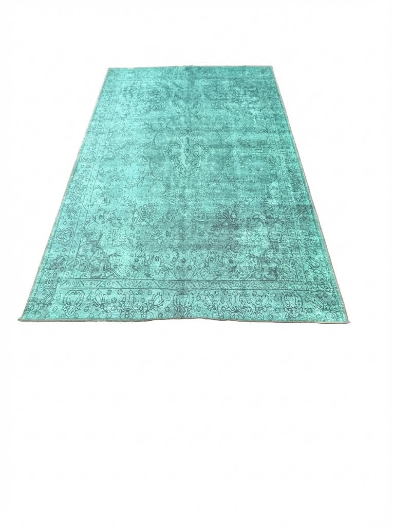 6' x 9' teal blue distressed vintage-style washable area rug featuring subtle charcoal and gray detailing with a non-slip backing.