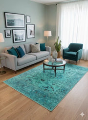 6' x 9' teal soft blue mint green floral vintage rectangular area rug styled in a contemporary living room.