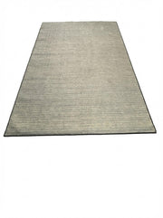 6' x 9' washable area rug featuring a subtle gray and beige tonal texture with a minimalist modern design and clean border.