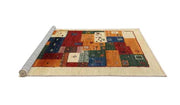 6x9 Brown Red Machine Washable Contemporary Rug displayed in a rolled-edge product view on a white background, showcasing its multicolor geometric patchwork pattern.