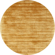 7' Round Gold & Beige Distressed Abstract Modern Area Rug displayed on a plain background.
