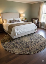 7' Round Navy & Beige Gold Traditional Medallion Area Rug placed / styled in a bright contemporary bedroom