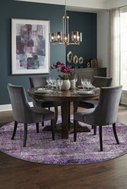 7' Round Purple Lavender Gray Distressed Abstract Modern Area Rug styled in a dining room with a round wooden dining table and gray upholstered chairs.