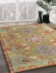 7' x 10' Green Multi-Color Tribal Medallion Traditional Persian Rug angled close-up displaying the detailed geometric medallions and decorative border pattern.