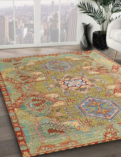 7' x 10' Green Multi-Color Tribal Medallion Traditional Persian Rug angled close-up displaying the detailed geometric medallions and decorative border pattern.