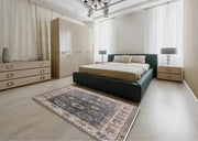 7' x 10' Puce Purple Mid-Century Modern Oriental Area Rug styled in a bedroom setting, demonstrating how the vintage-inspired pattern complements neutral furniture.