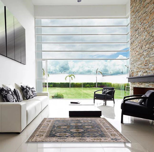 7' x 10' Puce Purple Mid-Century Modern Oriental Area Rug styled in a bright living room, highlighting the classic ornamental pattern and soft muted tones.