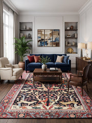 7' x 10' Rectangular Black Red Multicolor Pictorial Animal Floral Traditional Oriental Area Rug styled in a living room with a navy blue sofa and wooden coffee table.
