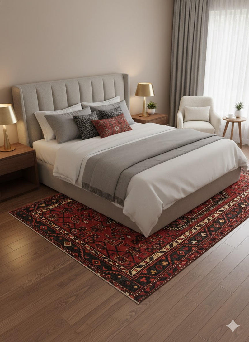 7' x 10' Rectangular Deep Brick Red & Multi Color Traditional Medallion Washable Area Rug placed in a cozy bedroom beneath a light upholstered bed with matching wood nightstands.