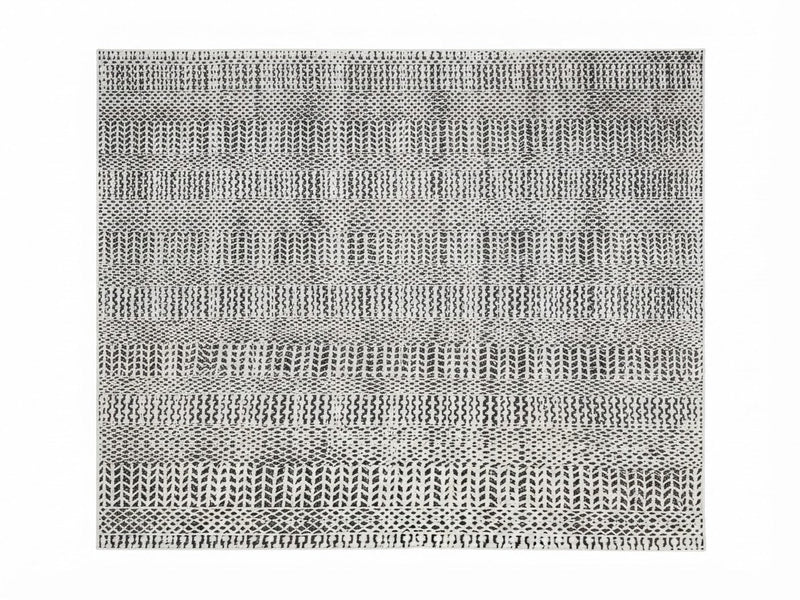 7' x 10' Rectangular Ivory & Black Striped Geometric Modern Tribal Washable Area Rug featuring horizontal bands of repeating geometric motifs, displayed in product view.