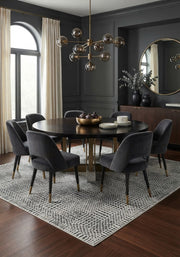 7' x 10' Rectangular Ivory Black Striped Geometric Modern Tribal Washable Area Rug styled in a dining room with a black dining table and gray upholstered chairs.