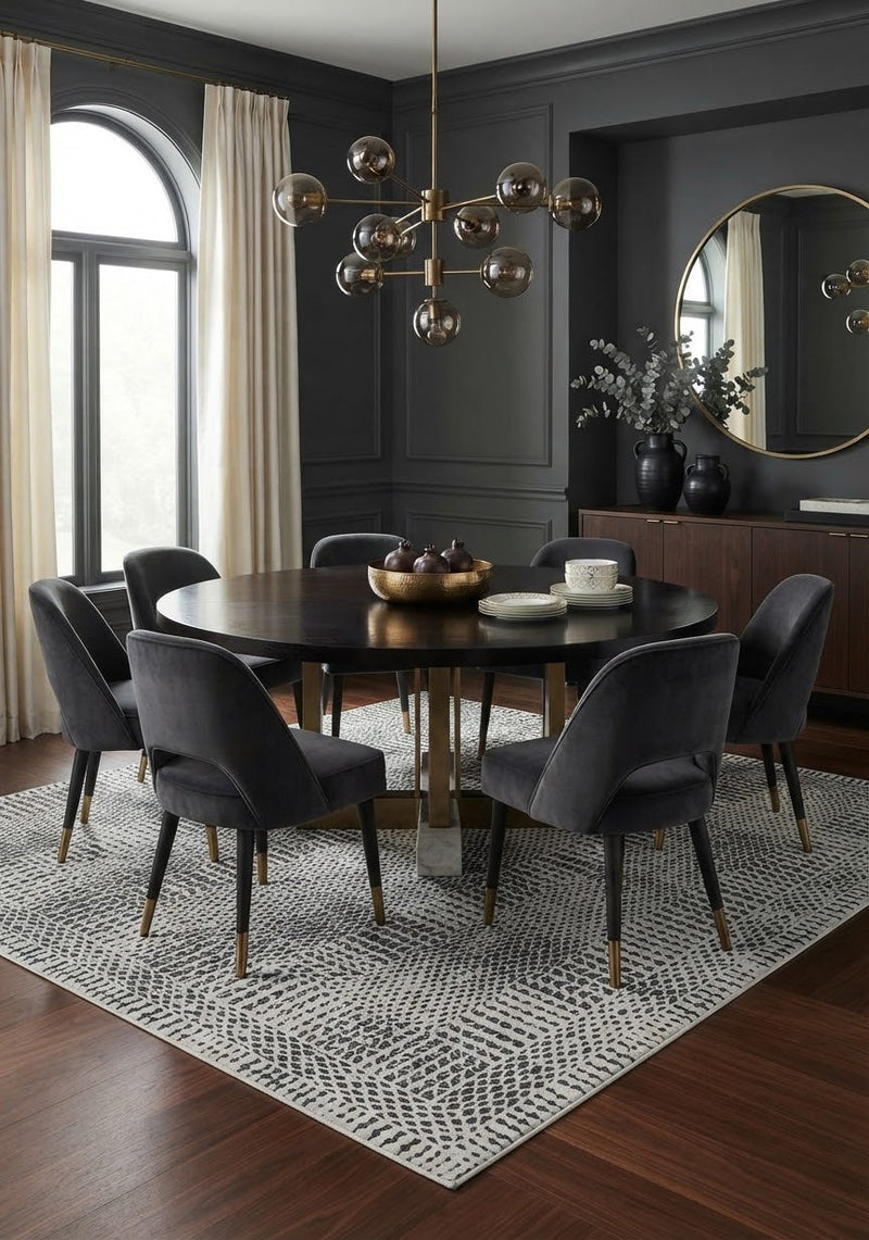 7' x 10' Rectangular Ivory Black Striped Geometric Modern Tribal Washable Area Rug styled in a dining room with a black dining table and gray upholstered chairs.
