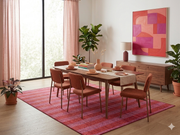7' x 10' Rectangular Red Pink Striped Contemporary Area Rug styled under a dining table in a modern dining room.