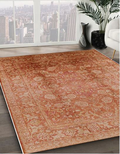7' x 10' Rectangular Rust Mango Orange & Beige Floral Medallion Oriental Mid-Century Modern Area Rug styled in a contemporary living room with city view windows.