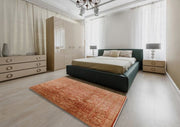 7' x 10' Rectangular Rust Mango Orange & Beige Floral Medallion Oriental Mid-Century Modern Area Rug styled in a modern bedroom.