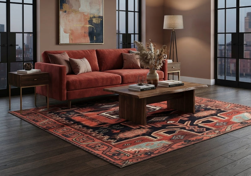 7' x 10' Rectangular Rust Red Black Geometric Medallion Traditional Southwestern Washable Area Rug styled in a living room with a rust red sofa and wooden coffee table.