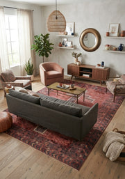 7' x 10' Rectangular Rust Red Charcoal Geometric Medallion Southwestern Traditional Area Rug styled in a living room with a gray sofa and wooden coffee table.