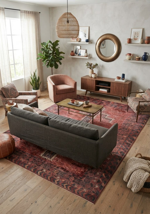 7' x 10' Rectangular Rust Red Charcoal Geometric Medallion Southwestern Traditional Area Rug styled in a living room with a gray sofa and wooden coffee table.
