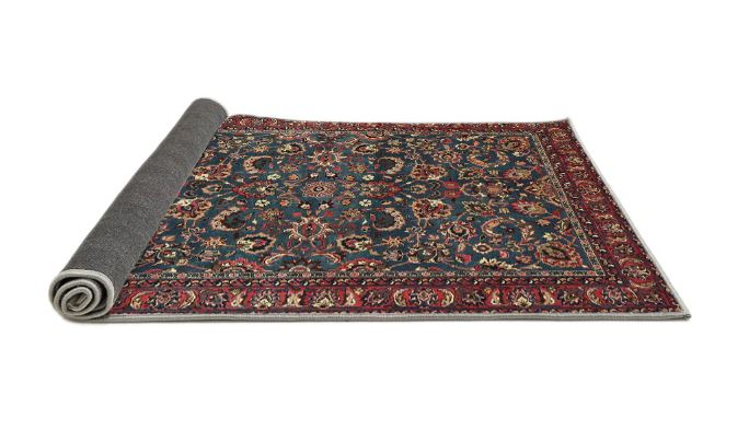 7' x 10' Red Multi Color Floral Traditional Persian Rug rolled corner view highlighting the low pile construction and flexible backing.