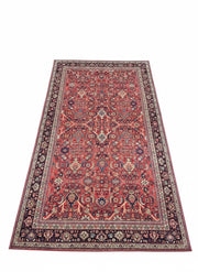 7' x 10' rectangular area rug featuring a red background with beige and soft brown floral medallion traditional pattern.