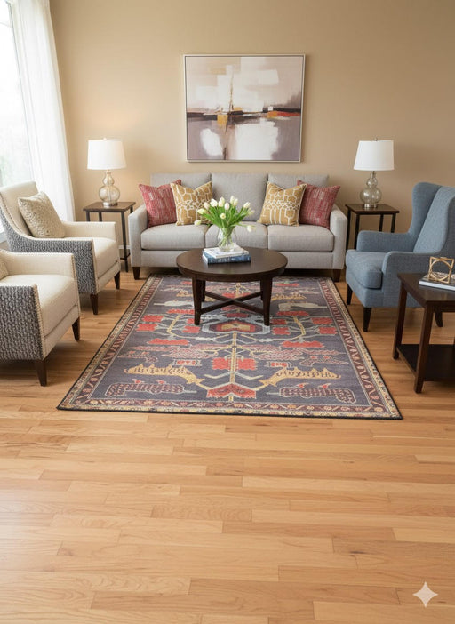7' x 10' vintage tribal medallion washable area rug with a charcoal gray background and rust red, gold, and ivory accents placed in a warm living room with neutral seating.