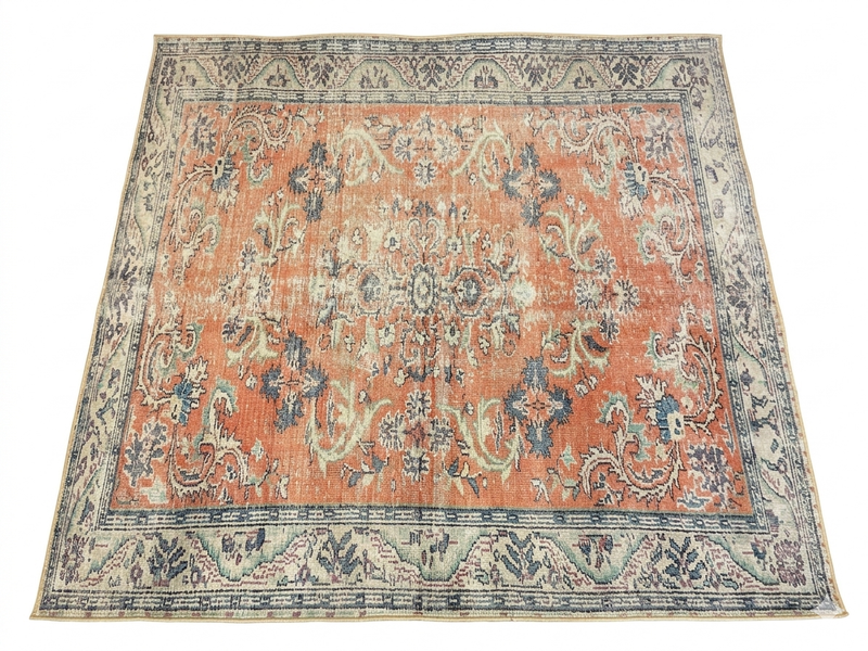 7' x 7' Square Coral Blue Distressed Floral Vintage Area Rug isolated on a white background.