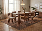 7' x 7' Square Dark Brown & Rust Distressed Abstract Modern Washable Area Rug styled in a dining room beneath a rectangular wooden dining table and matching chairs.