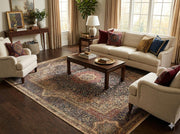 7' x 7' Square Deep Navy Multi Color Traditional Persian Medallion Area Rug placed / styled in a bright traditional living room beneath a dark wood coffee table, surrounded by cream upholstered seating and warm wood flooring.