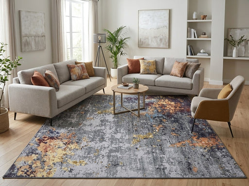 7' x 7' Square Gray Gold & Rust Distressed Abstract Modern Washable Area Rug styled in a living room with two gray sofas and a round wooden coffee table.