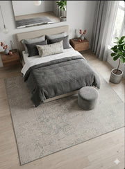 7' x 7' Square Ivory & Gray Distressed Abstract Modern Area Rug placed beneath a modern bed in a serene bedroom.