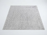 7' x 7' Square Ivory & Light Gray Distressed Textured Modern Washable Area Rug featuring a subtle speckled design with a softly weathered appearance.