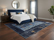 7' x 7' Square Navy Blue & Multicolor Tribal Geometric Southwestern Area Rug placed in a bedroom beneath a navy upholstered bed with white bedding.