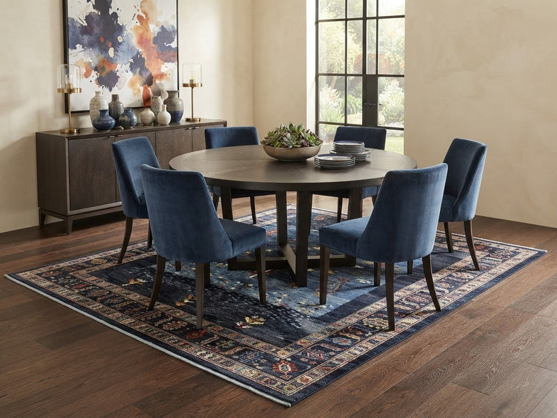 7' x 7' Square Navy Blue & Multicolor Tribal Geometric Southwestern Area Rug styled in a dining room beneath a round dark wood table and blue upholstered chairs.