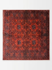 7' x 7' Square Red & Navy Tribal Geometric Traditional Area Rug featuring repeating tribal motifs, dark navy geometric borders, and a rich red background.